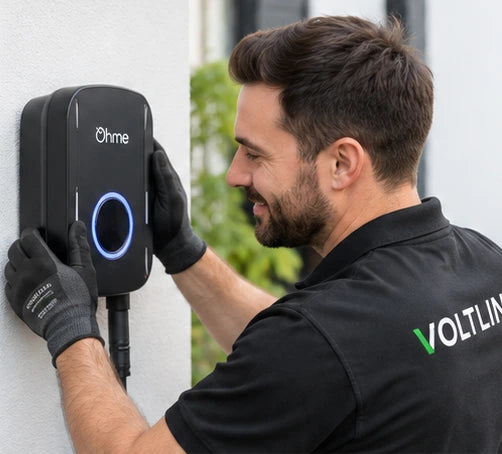 Illustrative scene of a male installer fitting a wall-mounted EV charger.